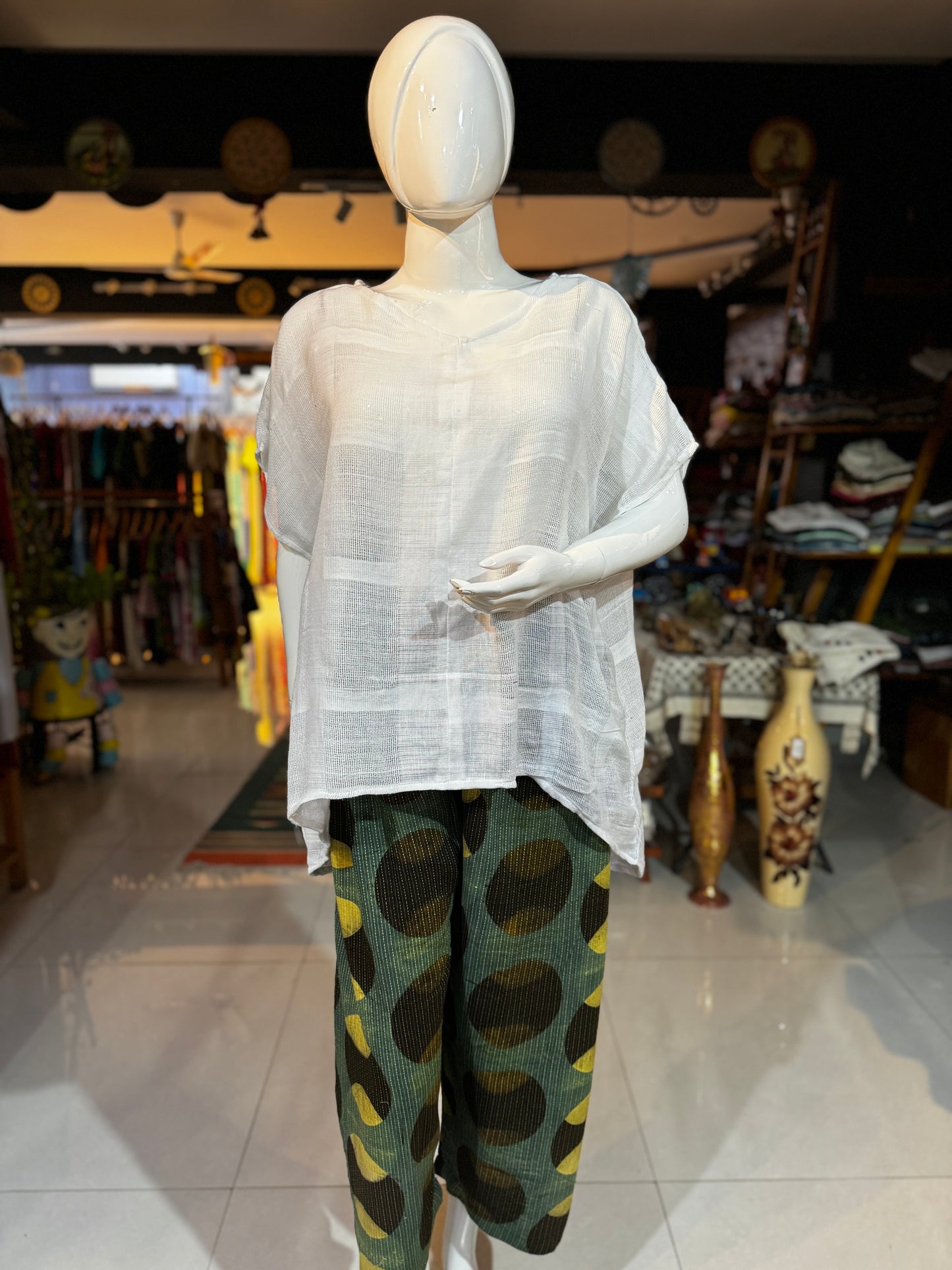 Green cotton hand block printed pants with black and yellow circular Ajrakh hand block prints