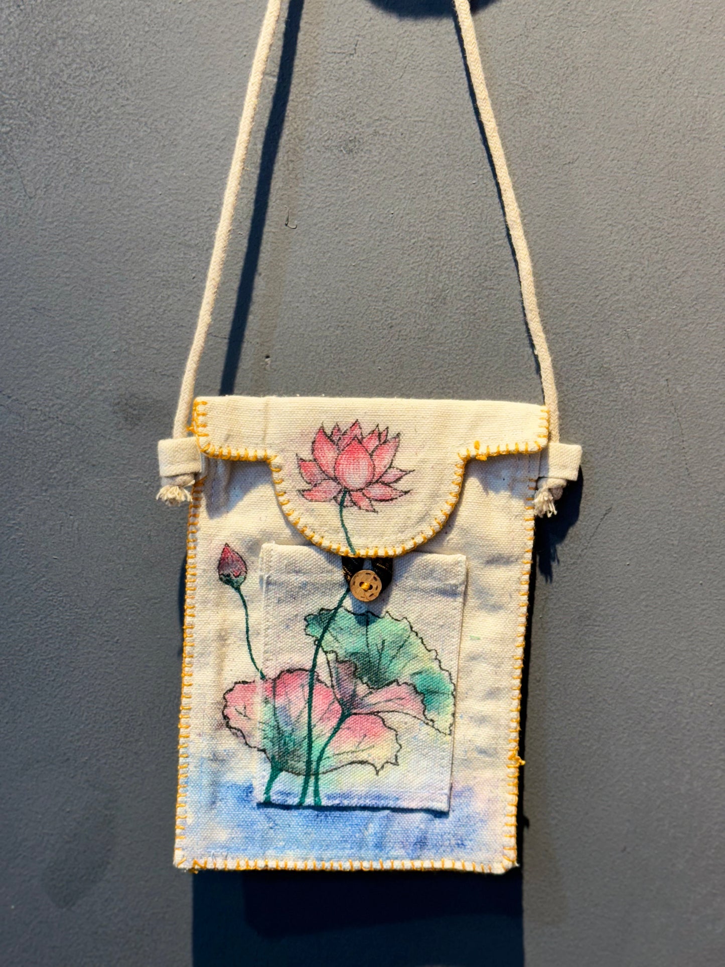 Hand painted mobile phone cotton canvas sling with button closure and a top pocket