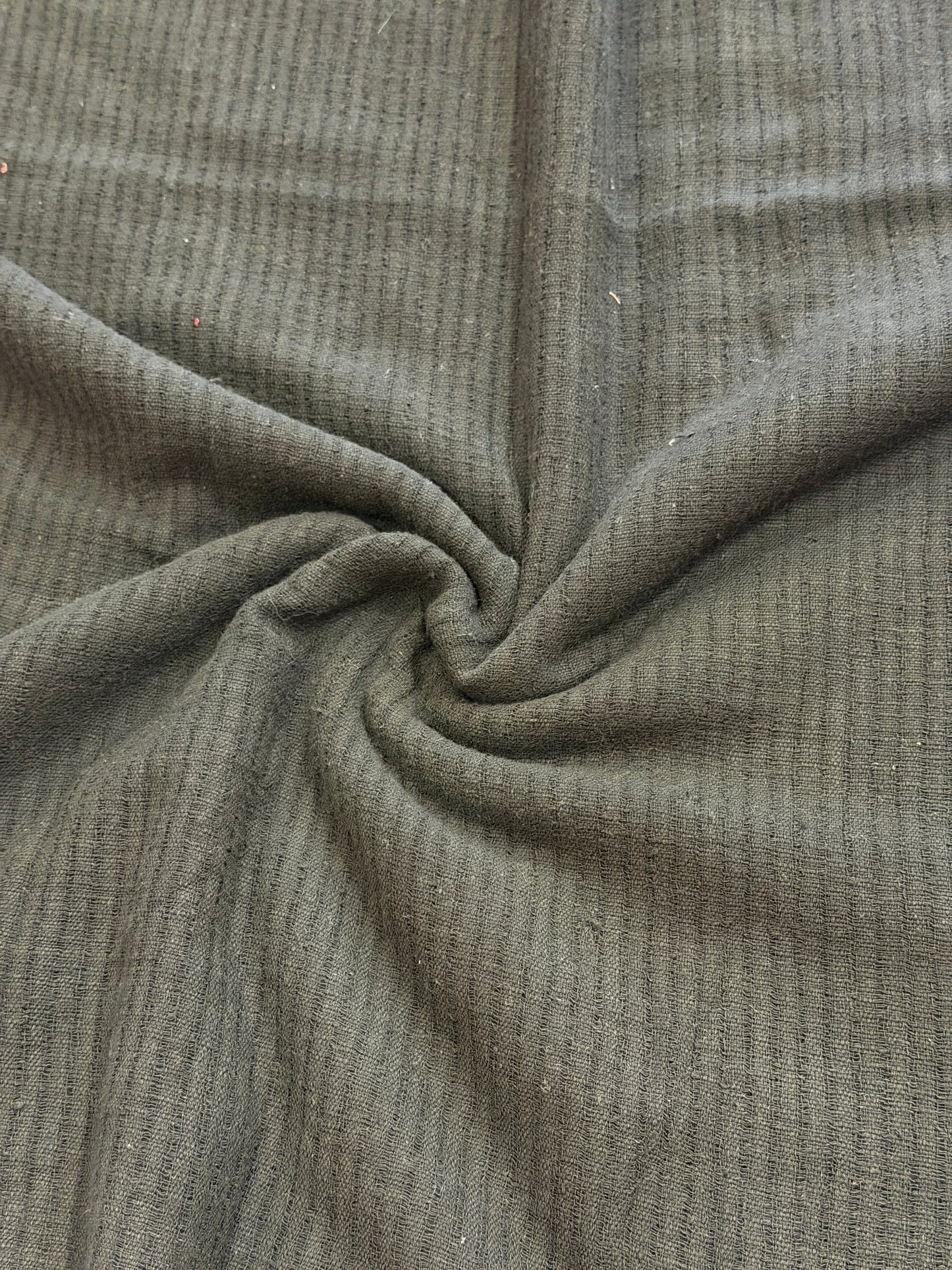 Black cotton hand spun, hand woven fabric with missing thread stripes weave