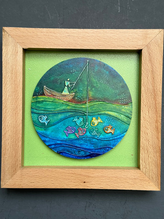 Rainbow hued lady on a boat fishing - handcrafted wall decor with wooden frame