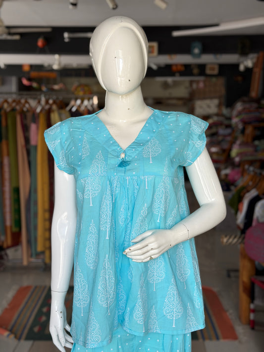 Blue dots and cypress print pleated cotton top with cowrie shell button