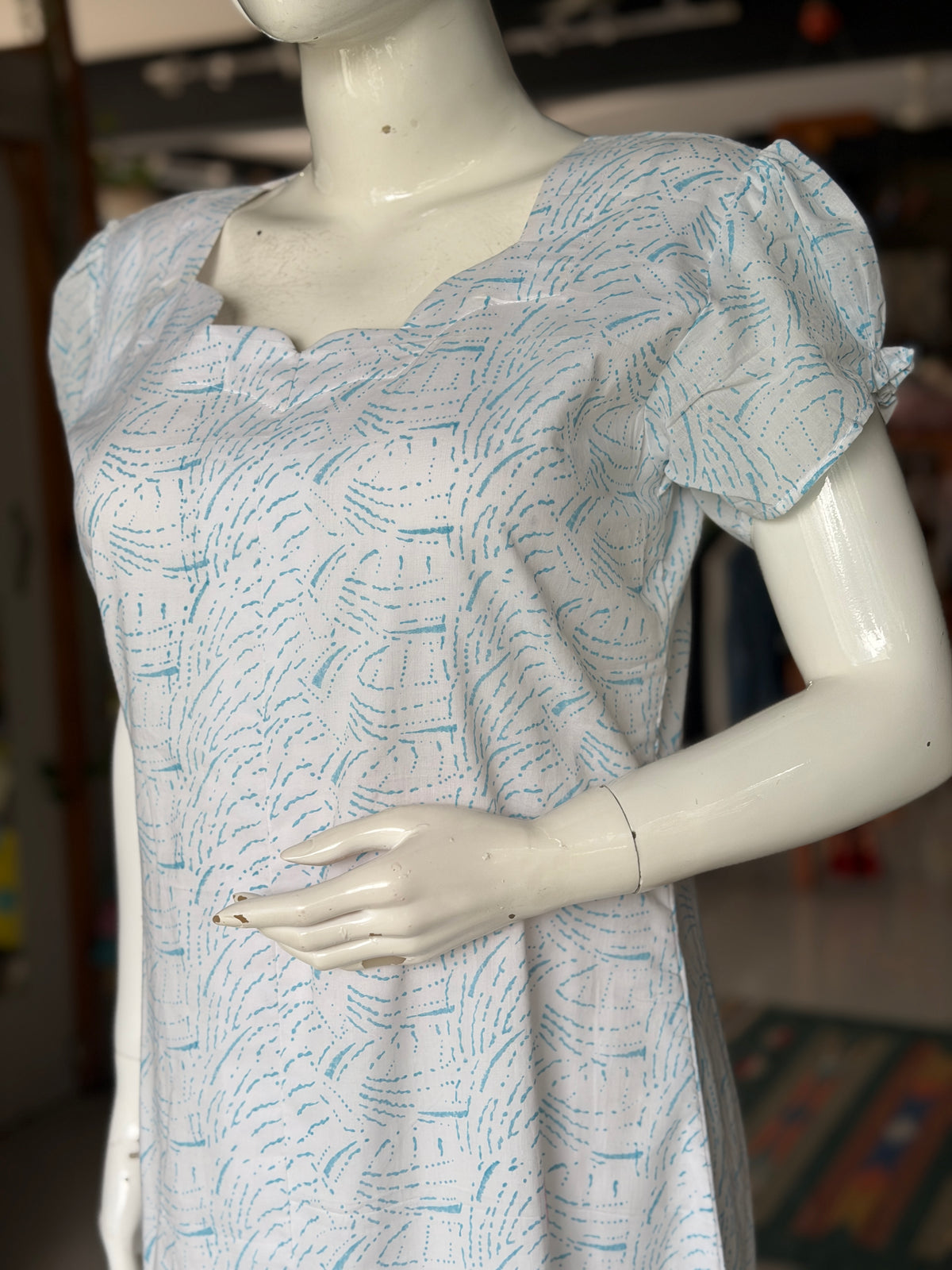 White A-line hand block printed soft cotton kurti with blue waves design