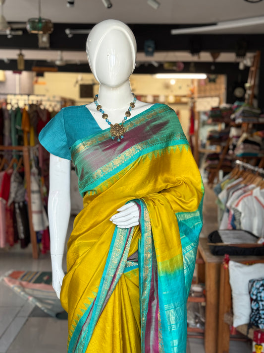 Beautiful mustard and green combination pure silk handwoven Gadwal saree with temple borders