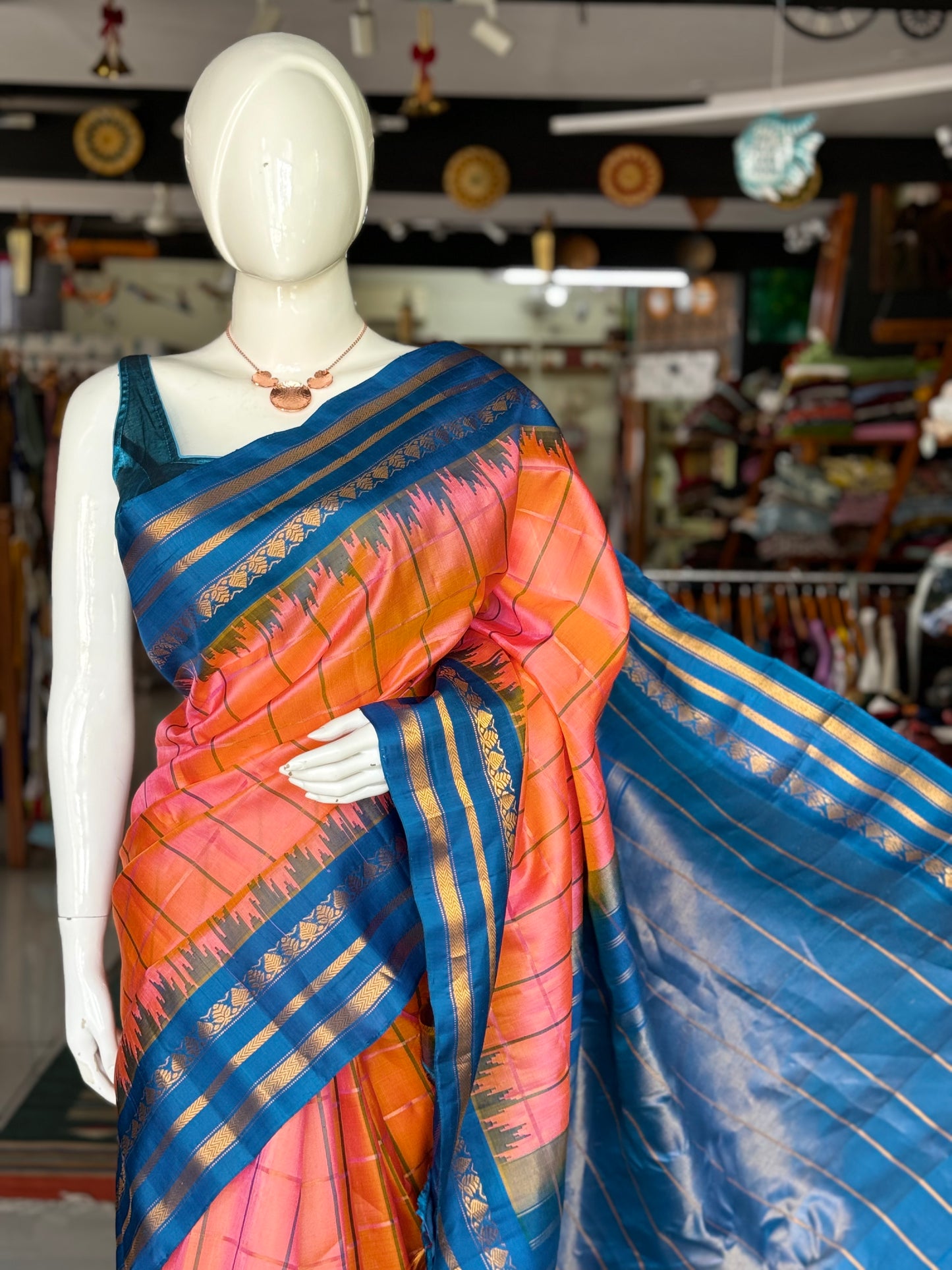 Peach and blue pure silk handwoven Gadwal checks saree with temple border