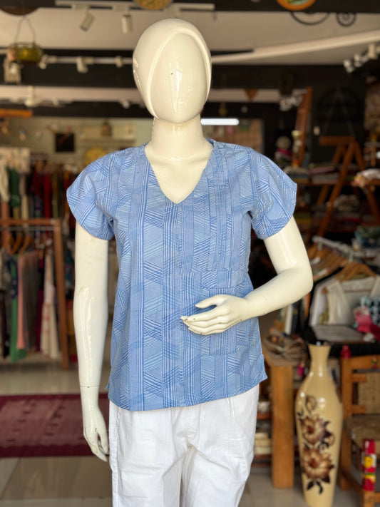 Blue geometric hand block printed cotton top with asymmetric pintucks and one side pocket