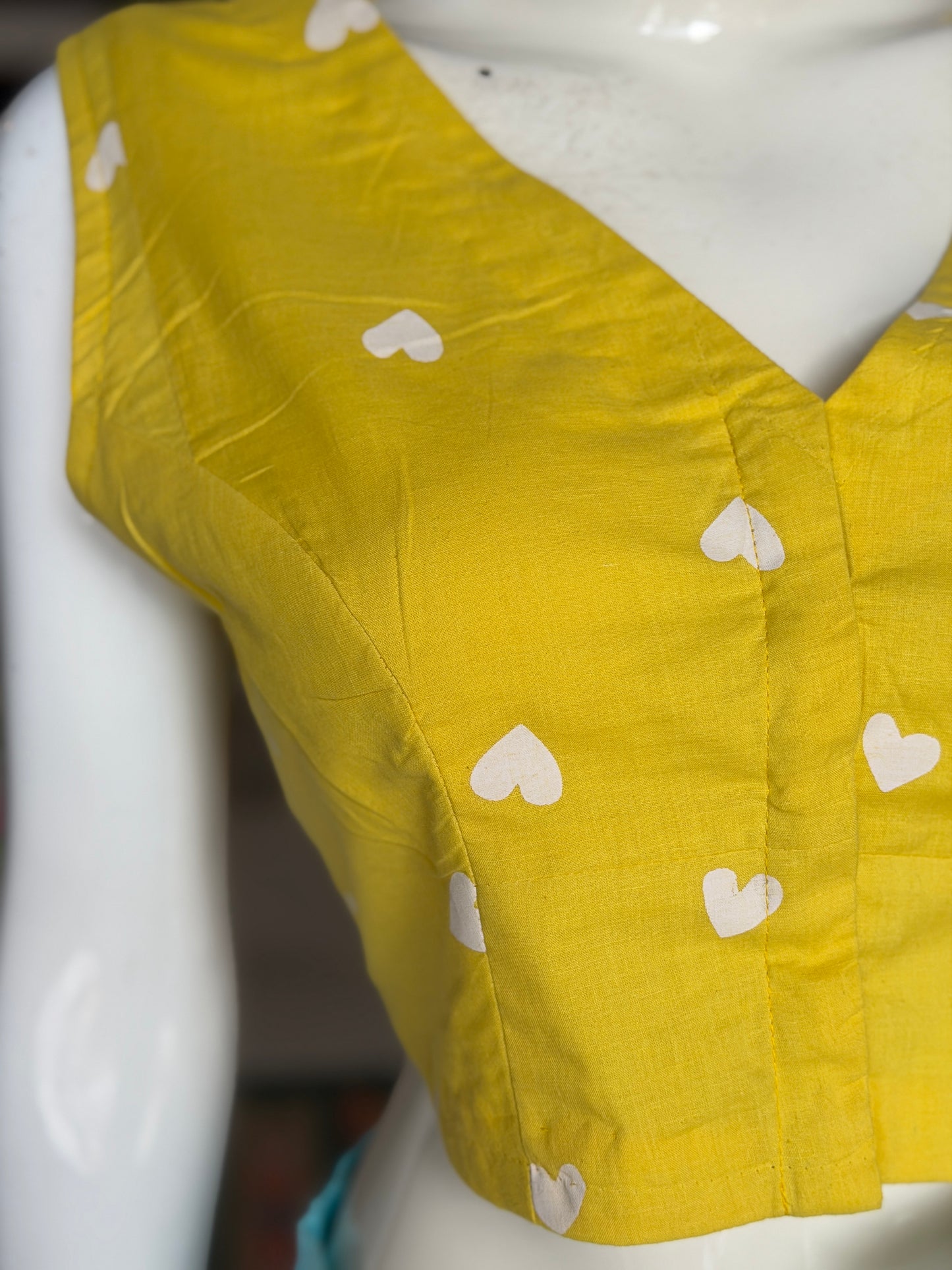 Yellow hearts print sleeveless cotton front open blouse