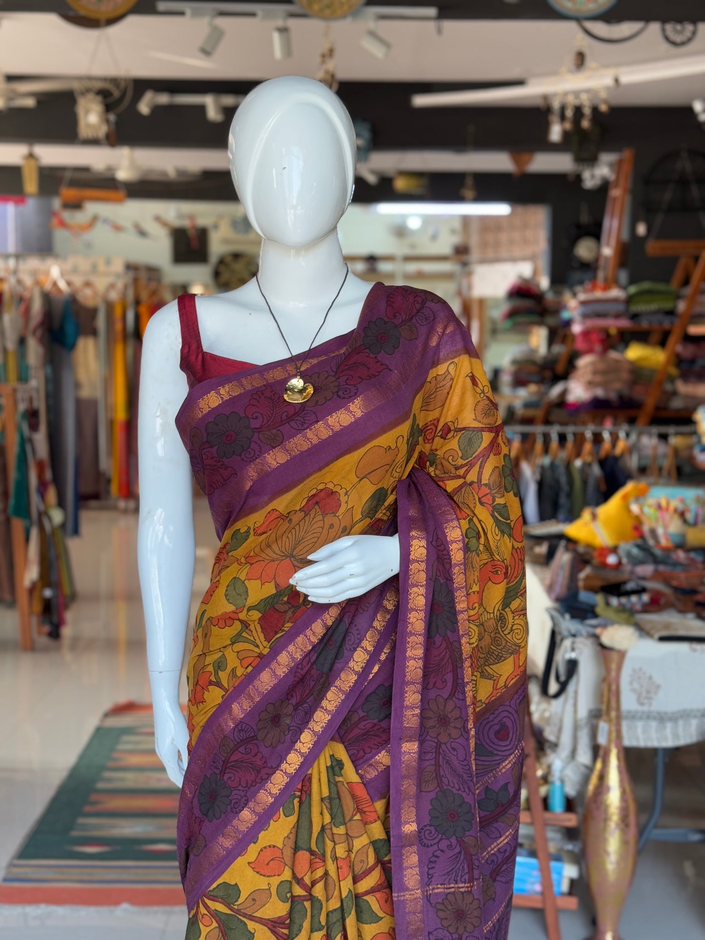 Mustard and purple floral design hand painted pen Kalamkari cotton saree