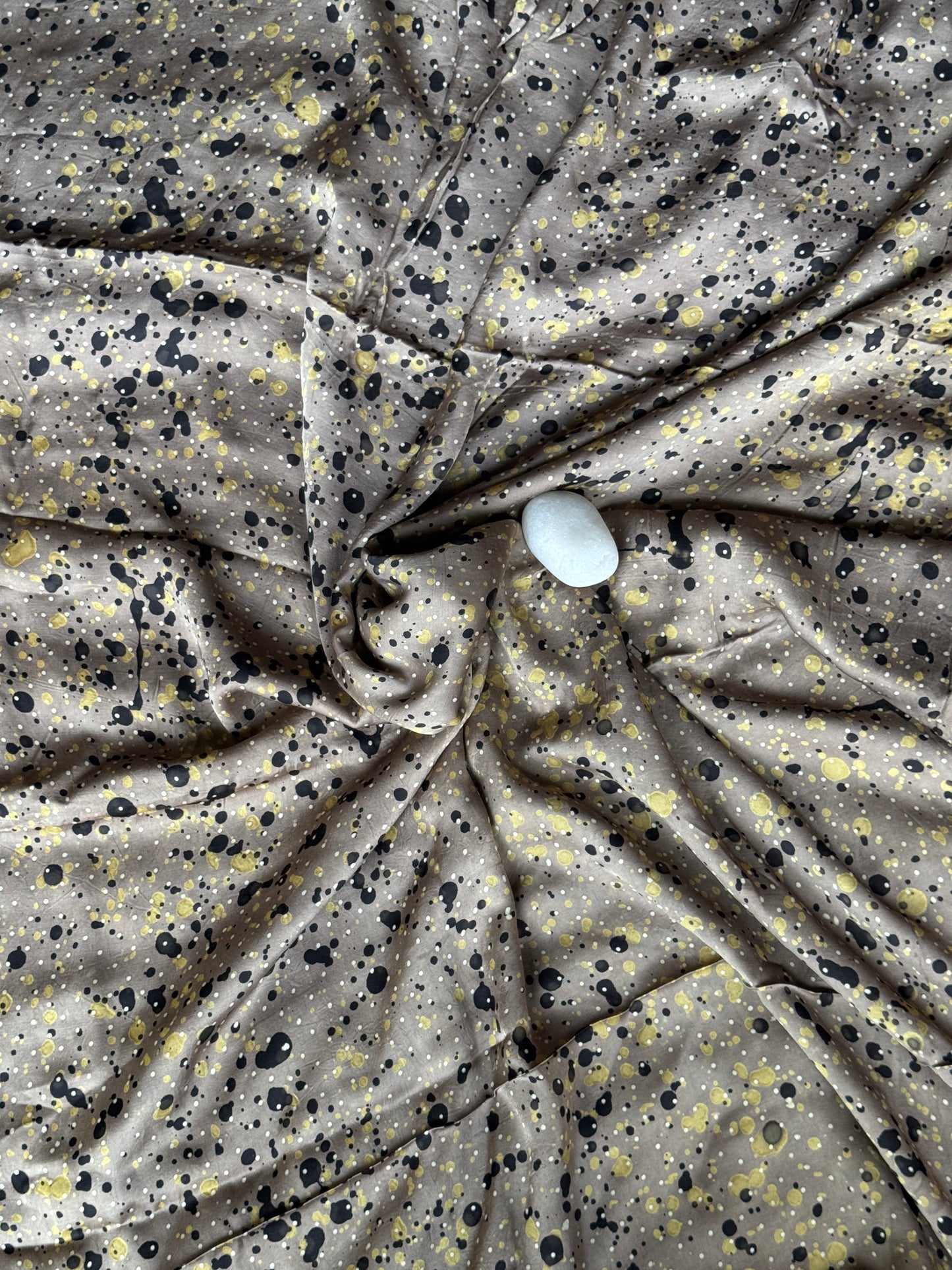 Greyish brown modal Ajrakh hand block print fabric with black and green splashes on it