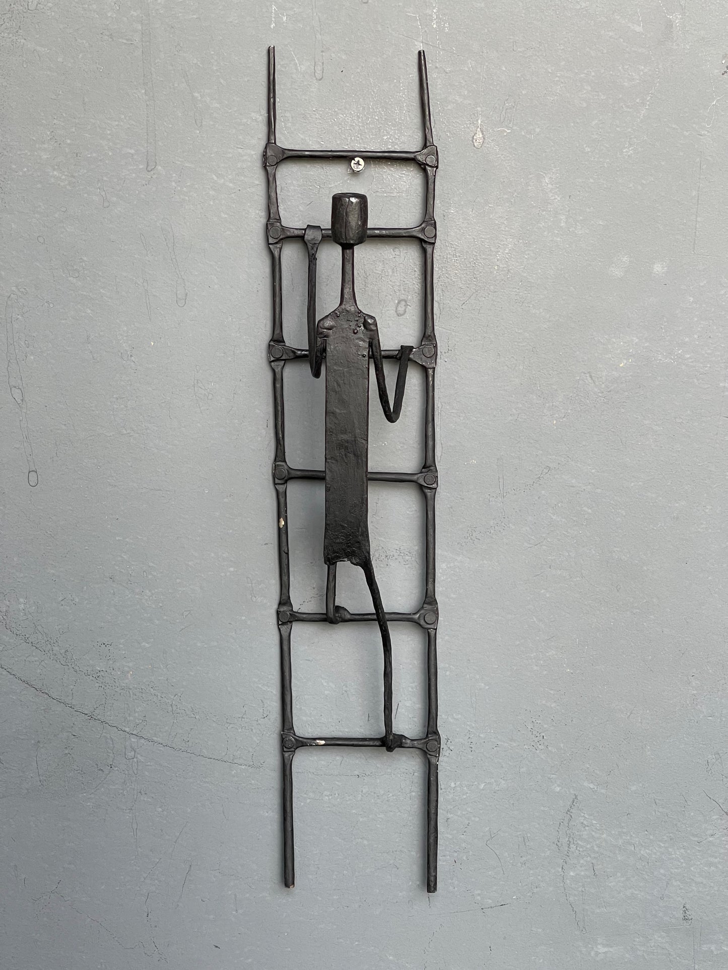 Person climbing ladder - handcrafted wrought iron