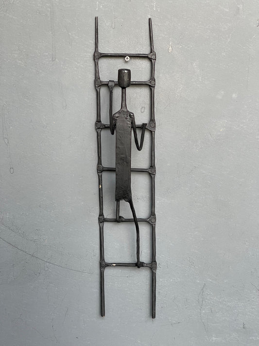 Person climbing ladder - handcrafted wrought iron