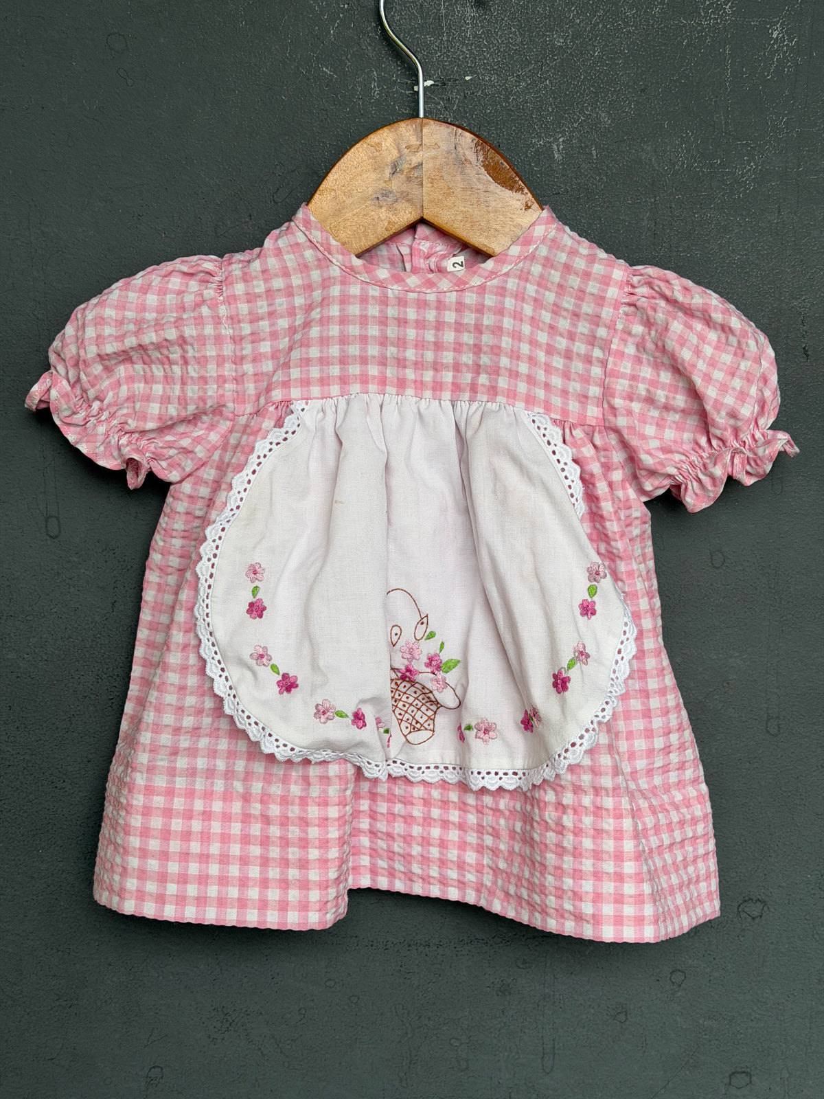 Pastel pink cotton frock for girls with white embroidered front flap