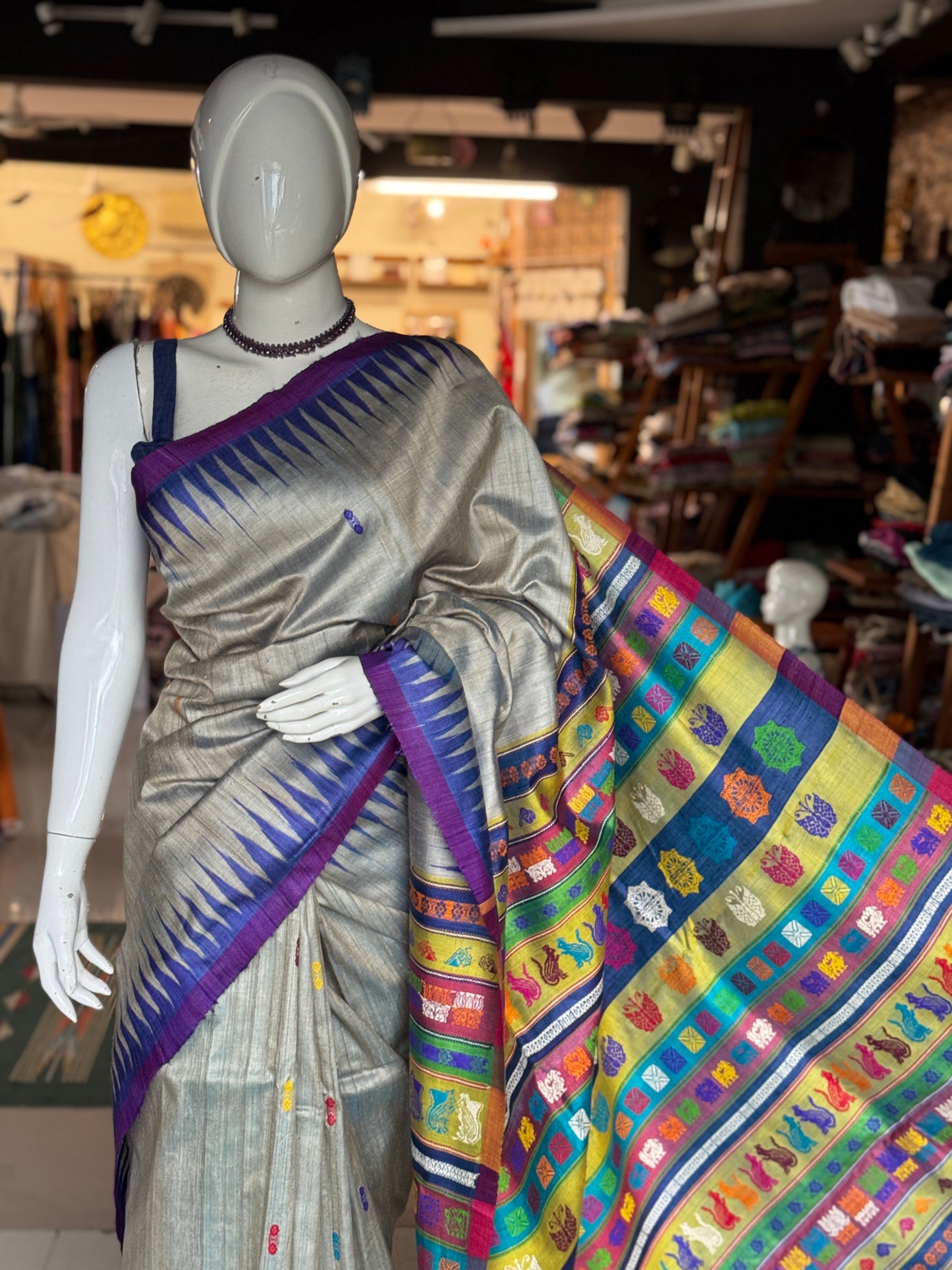 Silver blue tone pure tussar silk handwoven saree with extra weft flower butis and colorful jala palla