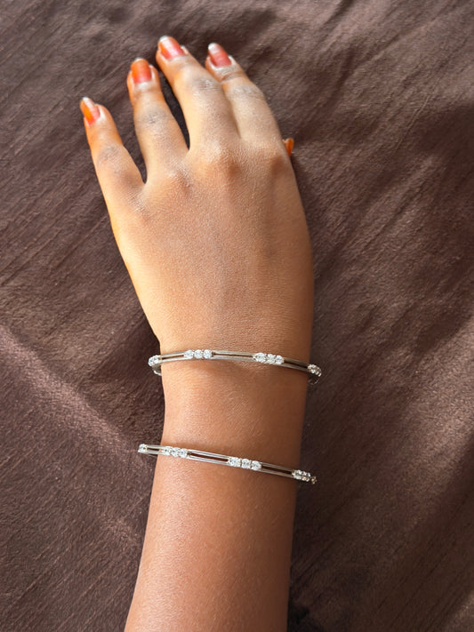 Silver bangles pair with white stone between 2 lines