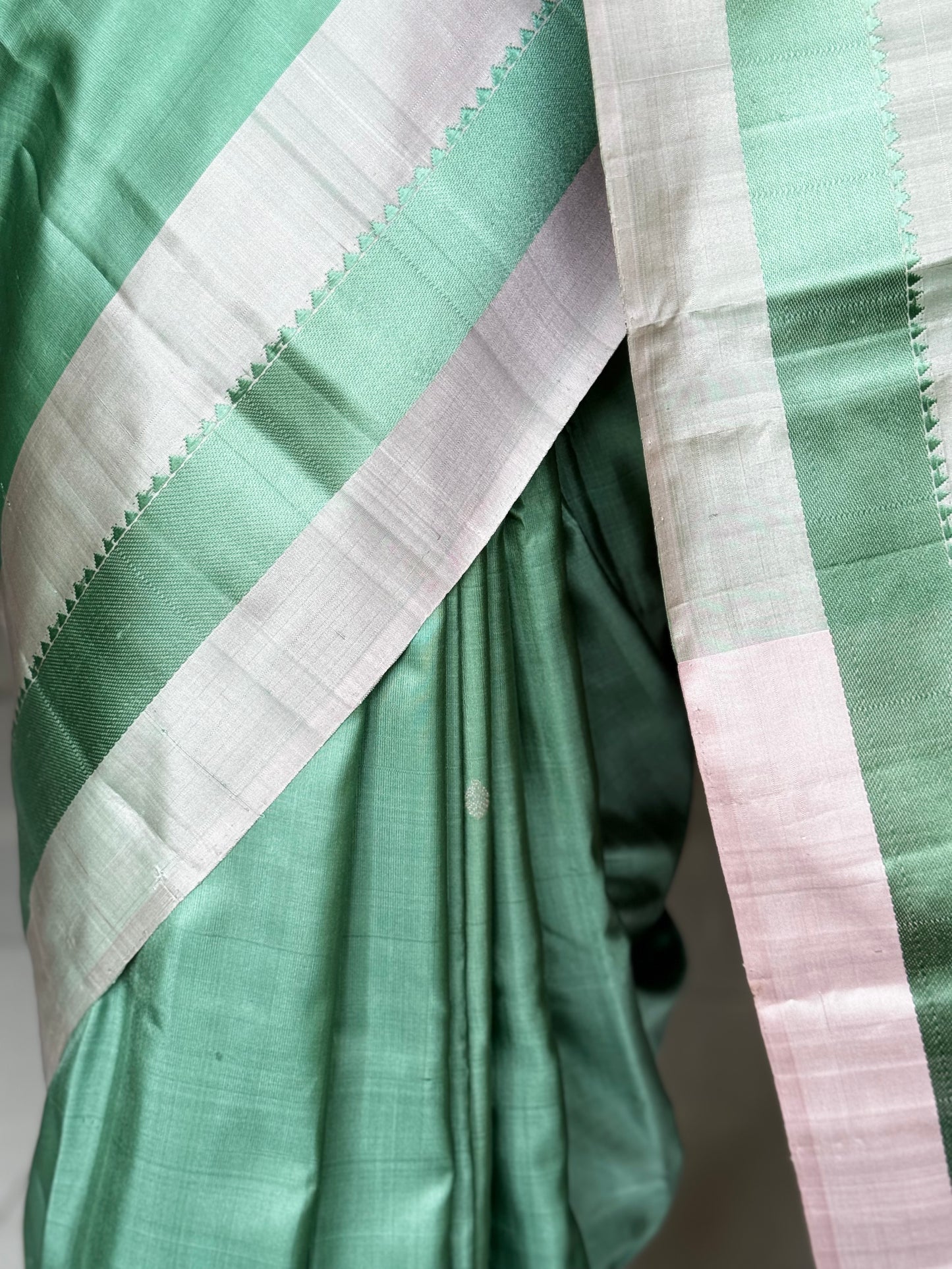 Green pure silk Kodiyala handloom saree with all over butis and light pink palla