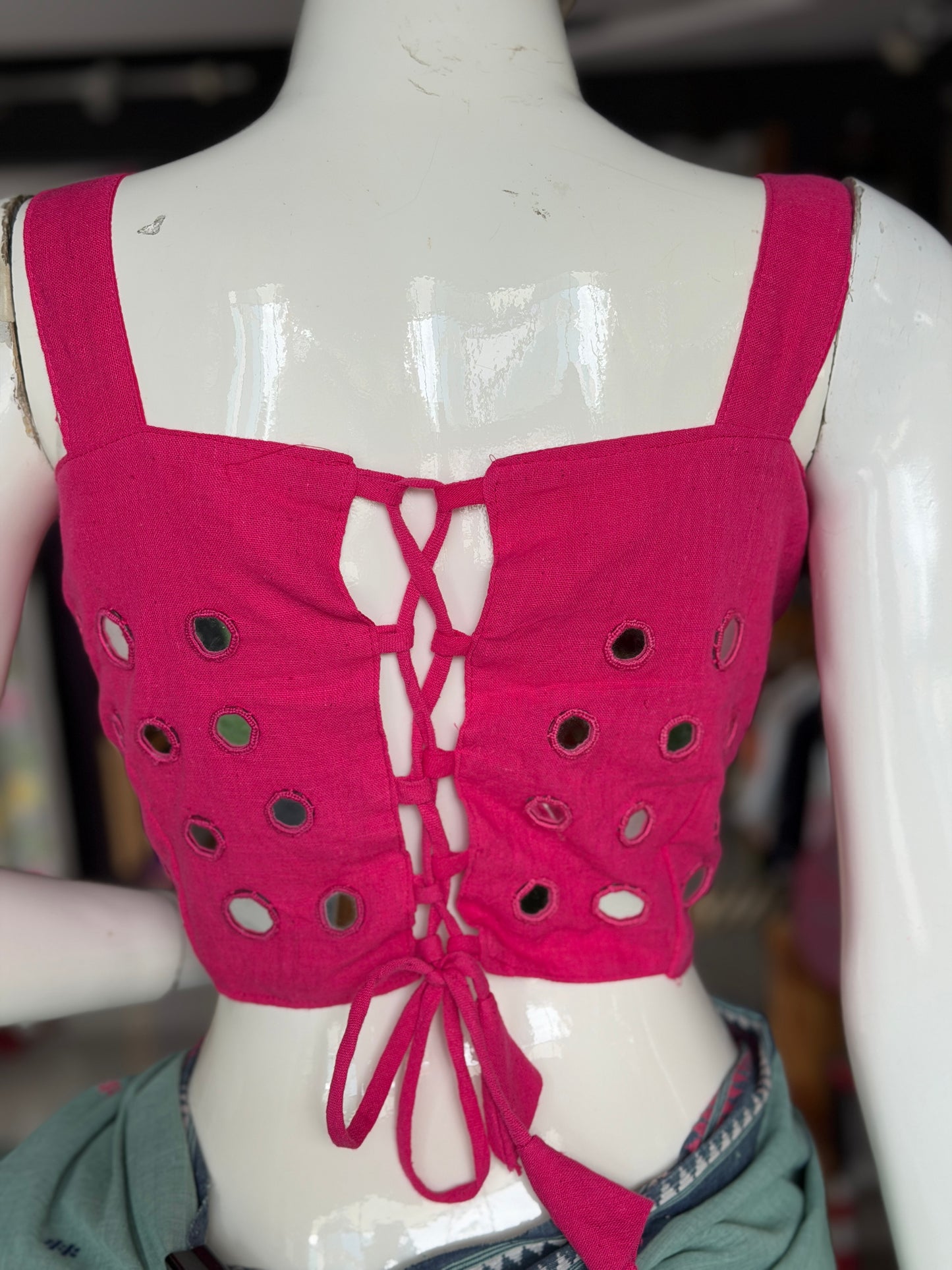 Dark pink kala cotton sleeveless blouse with all over mirror work on front and back with adjustable width back
