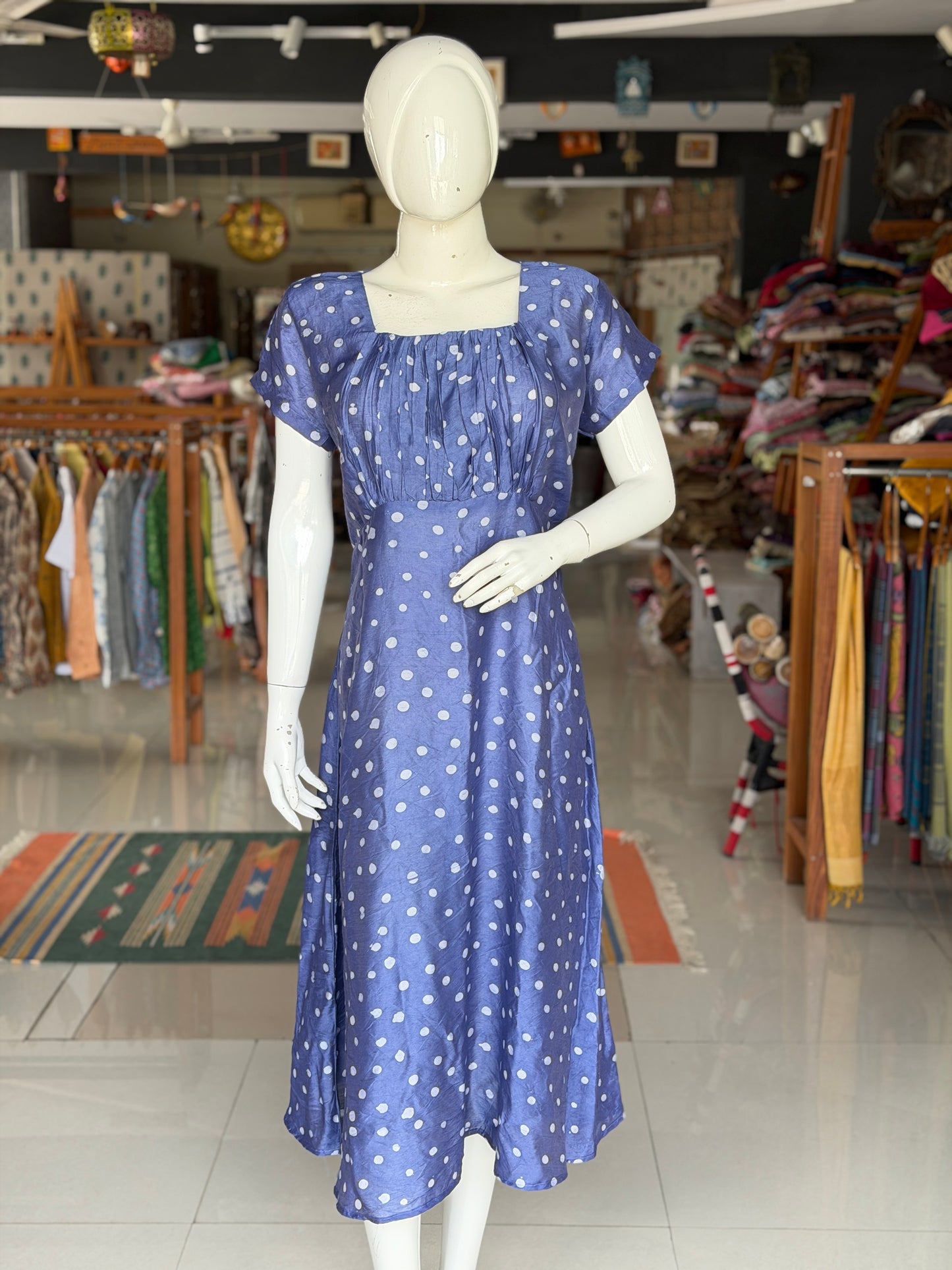 Blue polka dots dress with square neckline and gathered bust