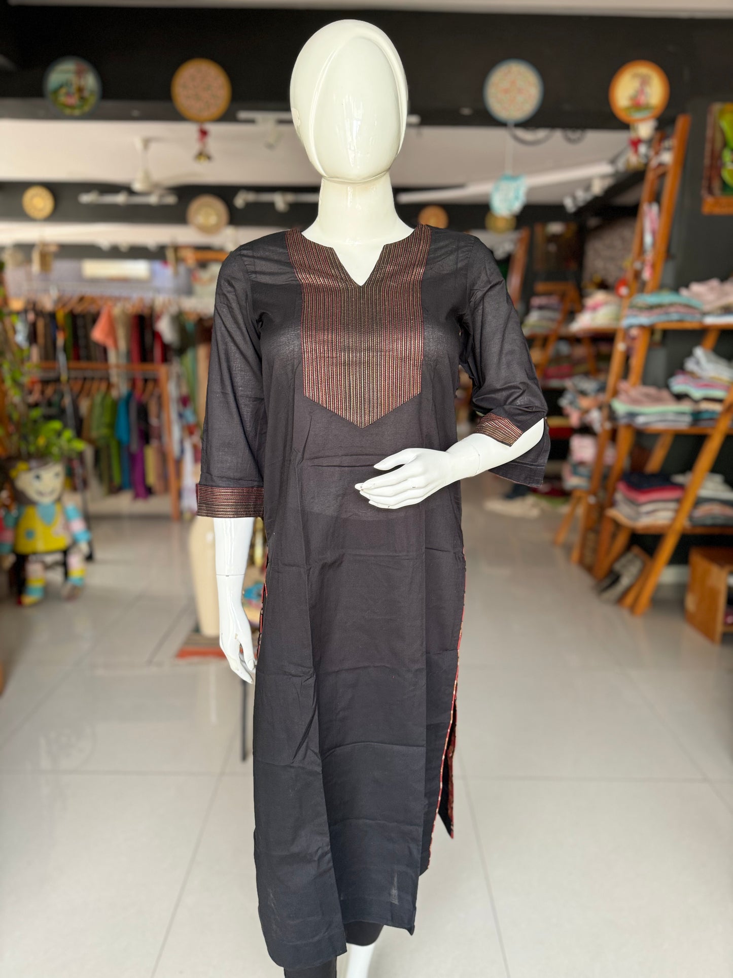 Black cotton kurti with thread work for yoke and sleeves