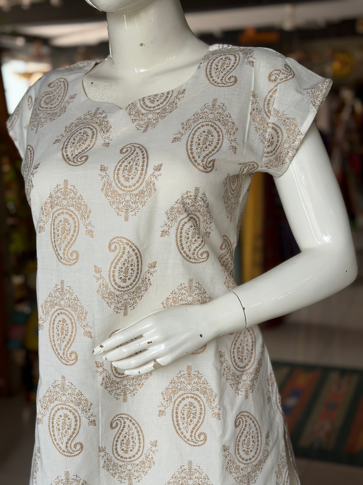 Off white paisley print cotton kurti paired with a matching stripes print barrel pants - 2 piece set