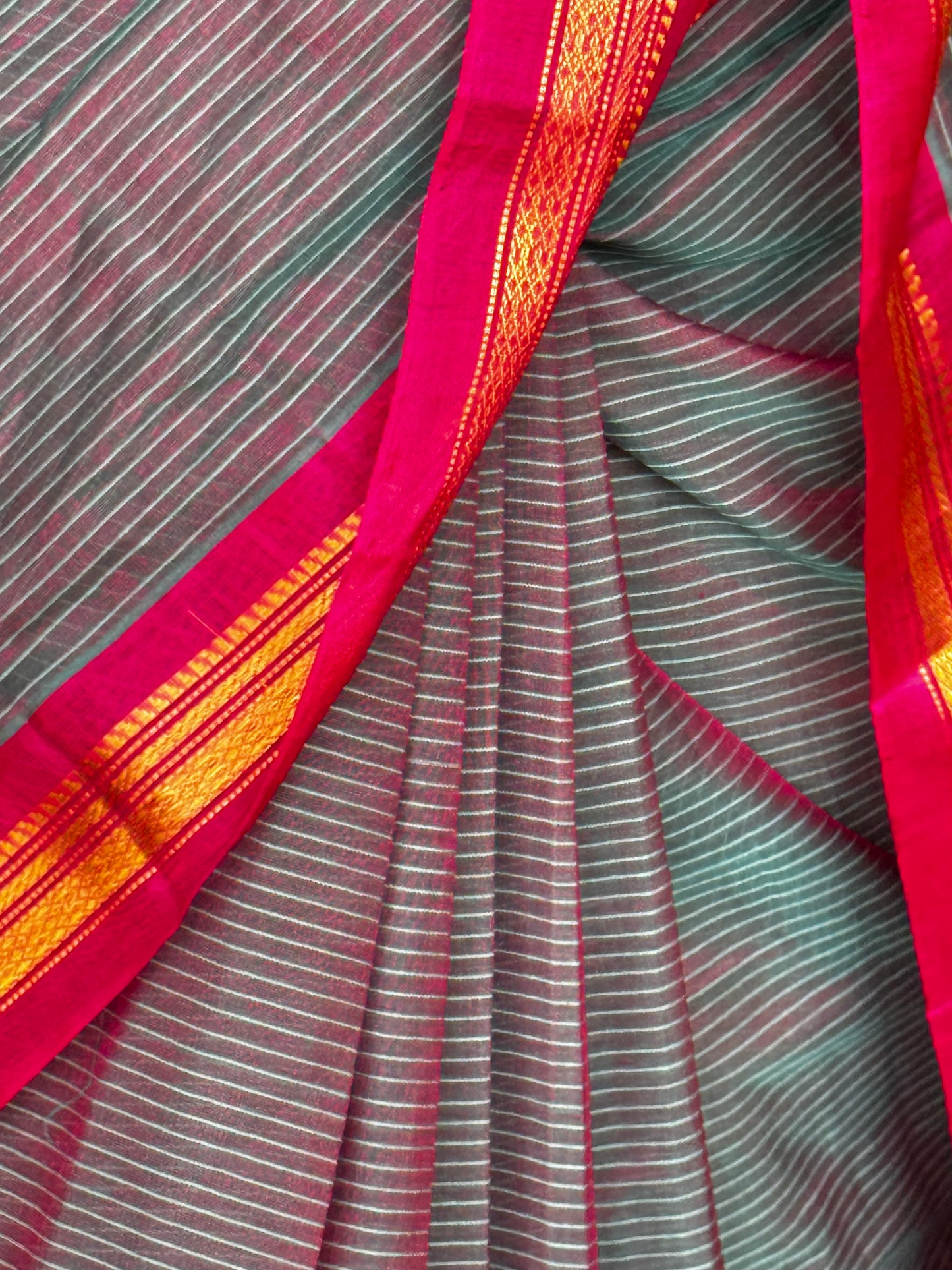 Handwoven Gadwal cotton saree with bright pink pure silk pallu and borders