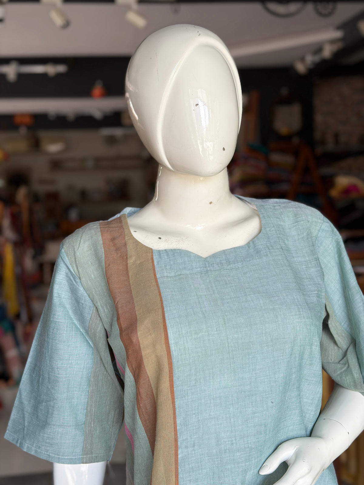 Green handloom cotton dress with hand woven kala cotton stripes on one side