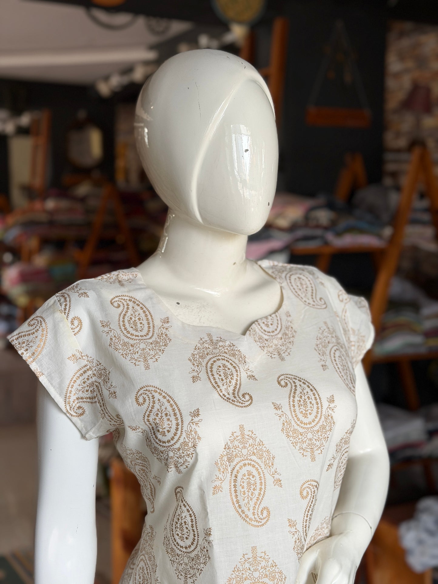 Off white paisley print cotton kurti paired with a matching stripes print barrel pants - 2 piece set