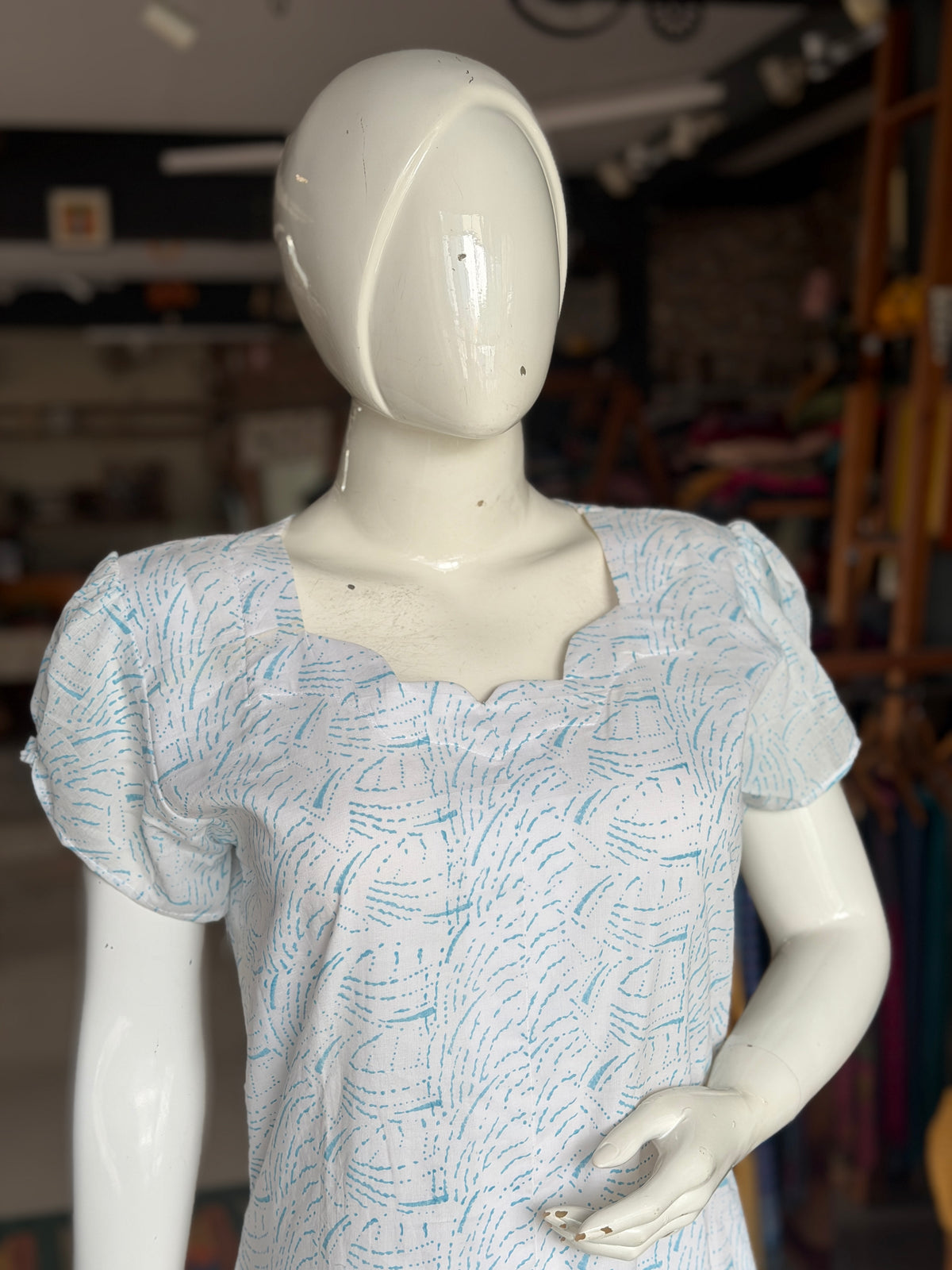 White A-line hand block printed soft cotton kurti with blue waves design