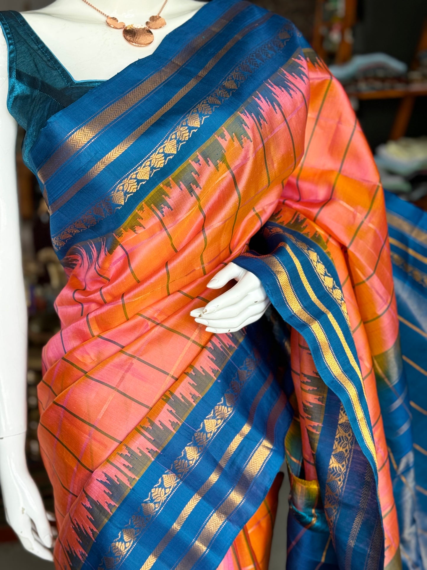 Peach and blue pure silk handwoven Gadwal checks saree with temple border