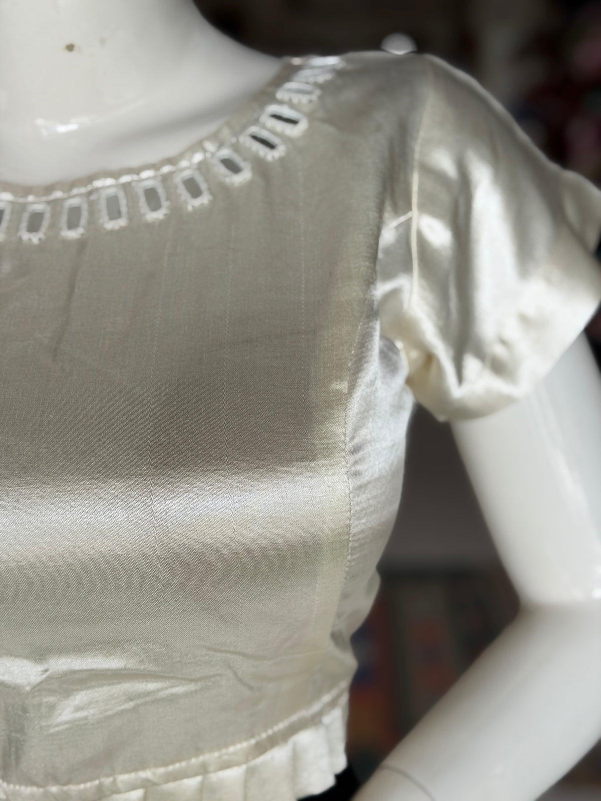Off white mashru plain blouse with mirror work on front and back; pleated waist line