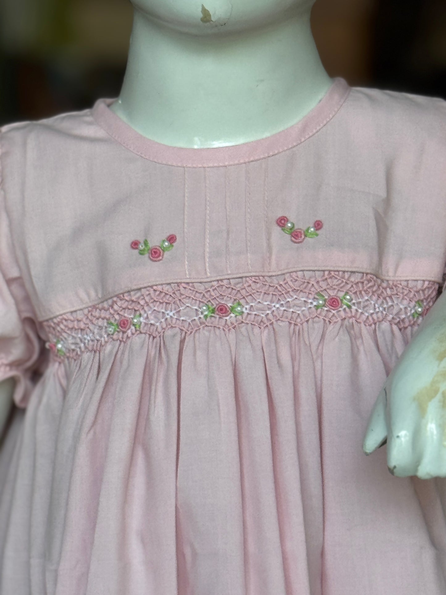 Light pink hand embroidered smocking cotton frock for girls with pintucks at neck