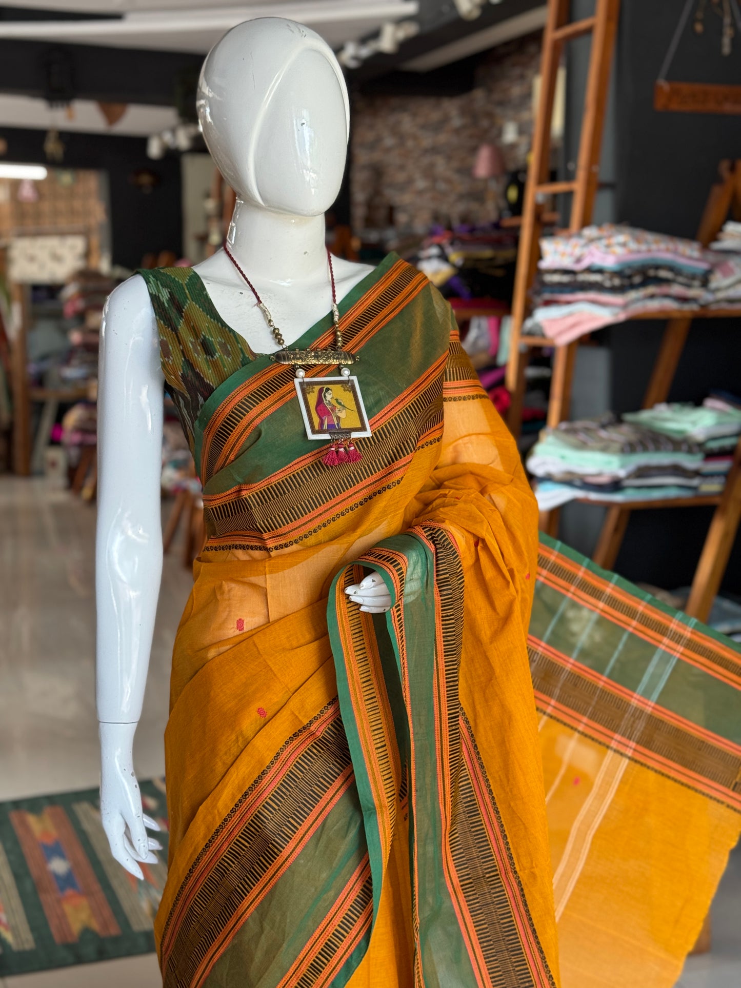 Mustard yellow and green Chettinad cotton handloom saree with butis all over and wide borders