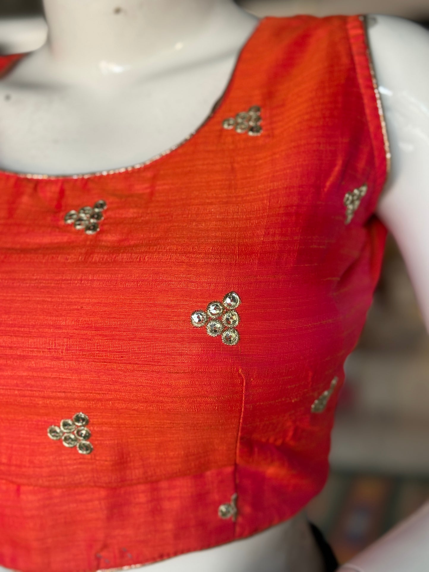Orange embroidered sleeveless blouse with deep back