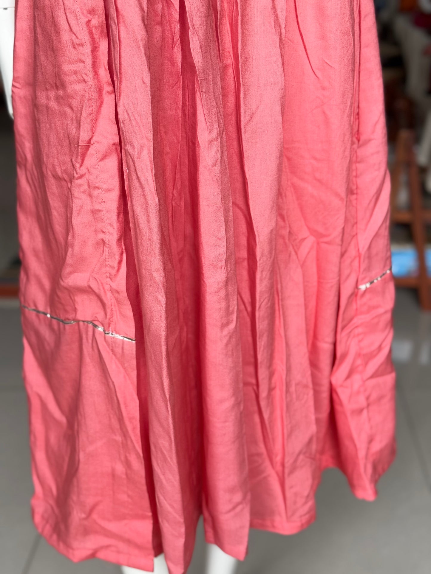 Peach soft rayon designer dress with low pleats and gota detailing