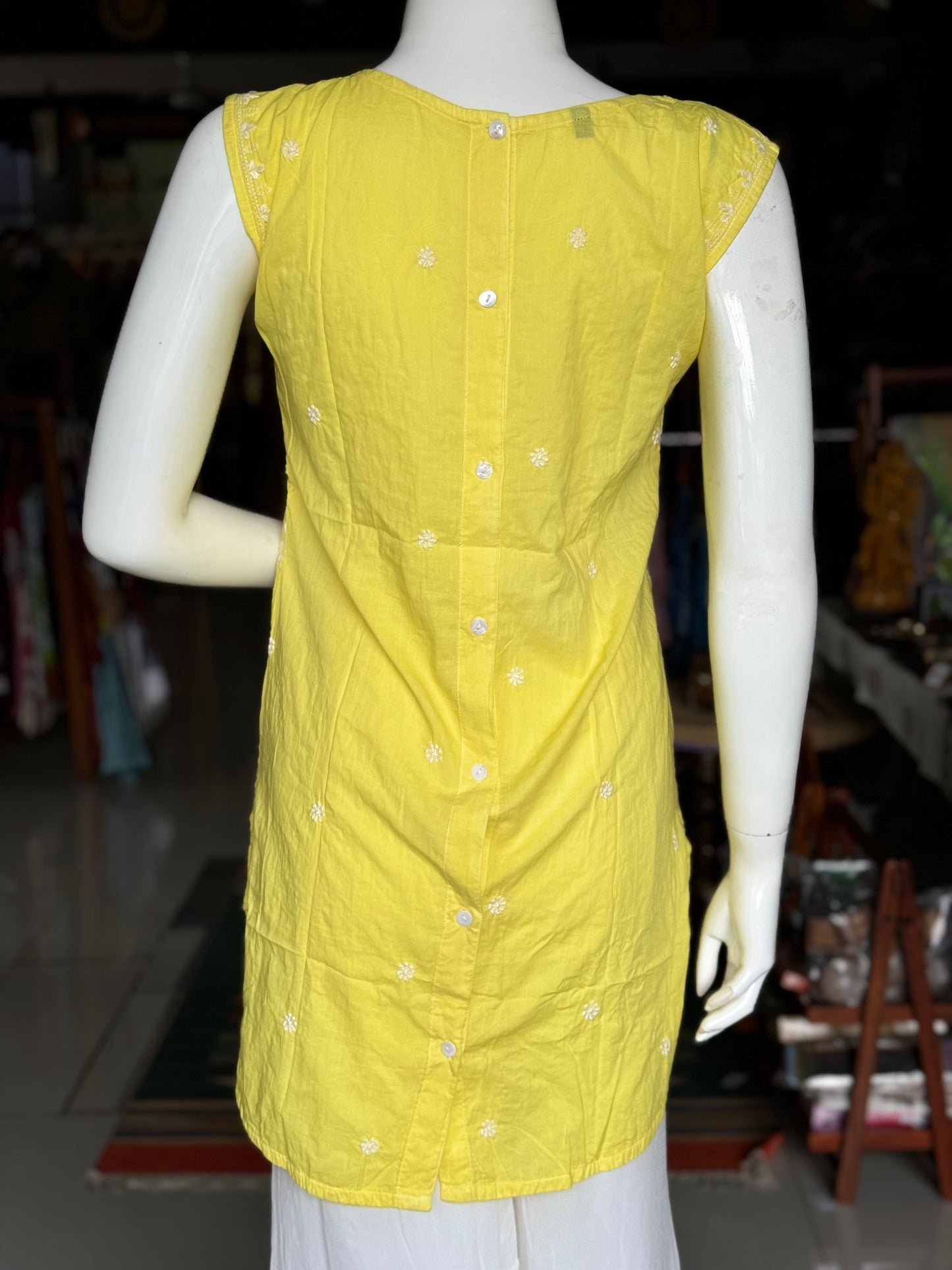 Lemon yellow cotton Chikankari hand embroidered sleeveless high low top with back buttons