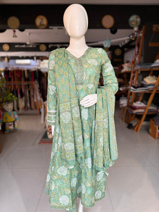 Pista green floral print cotton flared Kurti, pants and dupatta set - with hand work on placket, lace on sleeves and tassels for dupatta