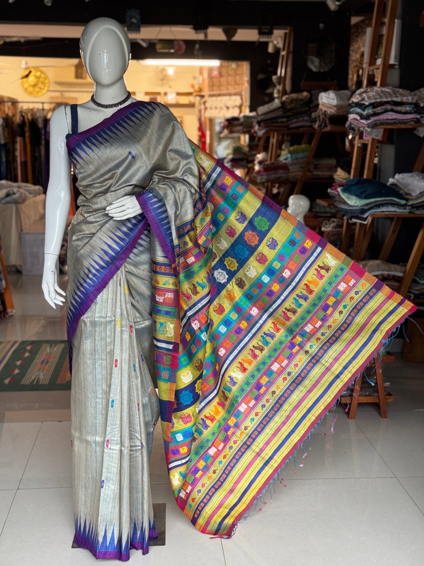 Silver blue tone pure tussar silk handwoven saree with extra weft flower butis and colorful jala palla