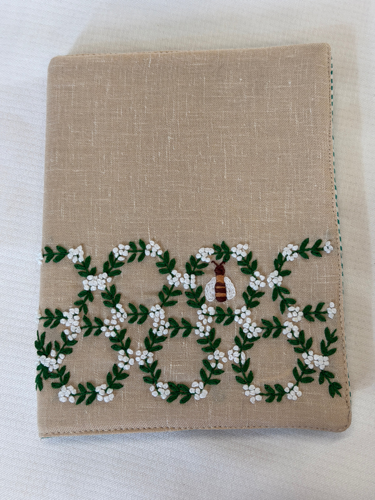 Beige hand embroidered reusable fabric cover / book sleeve with journal notebook inside