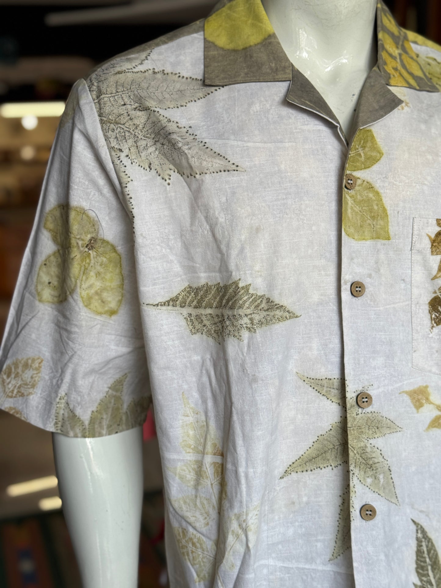 Off white eco friendly leaf printed cotton half sleeves loose fit shirt for men