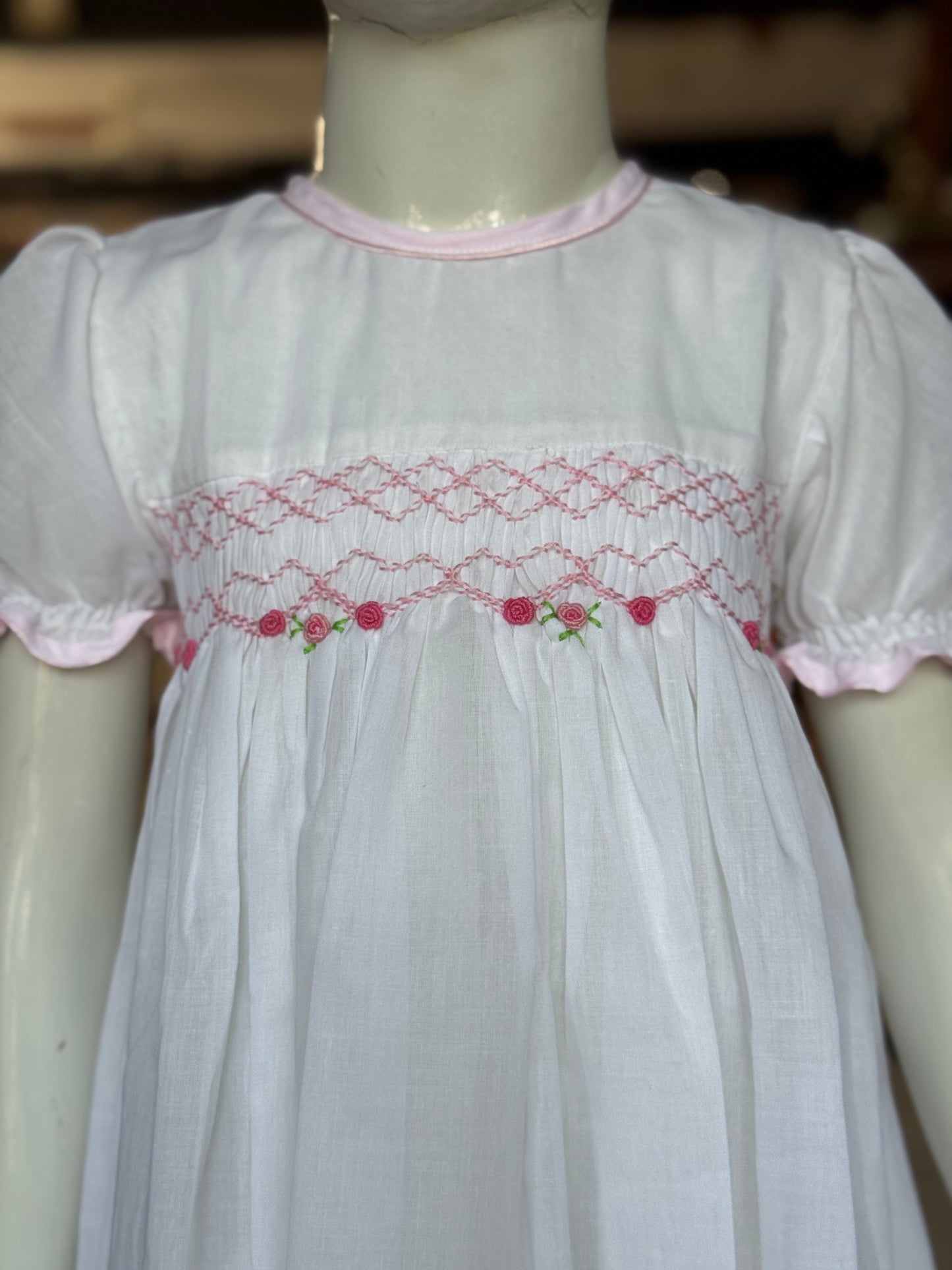 White hand embroidered smocking cotton frock for girls with pink trims