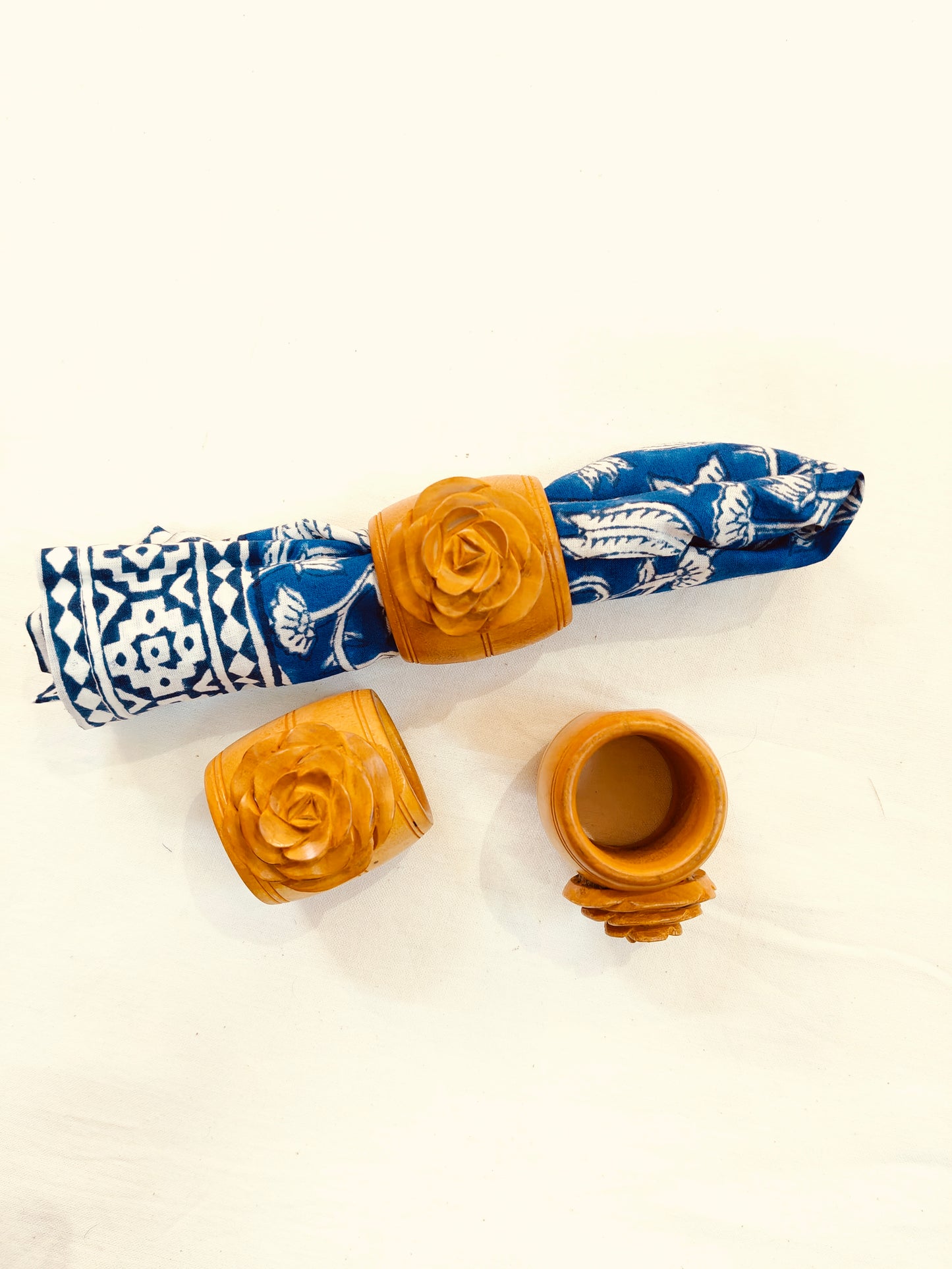 Wooden hand carved napkin ring with a beautiful carved rose on top