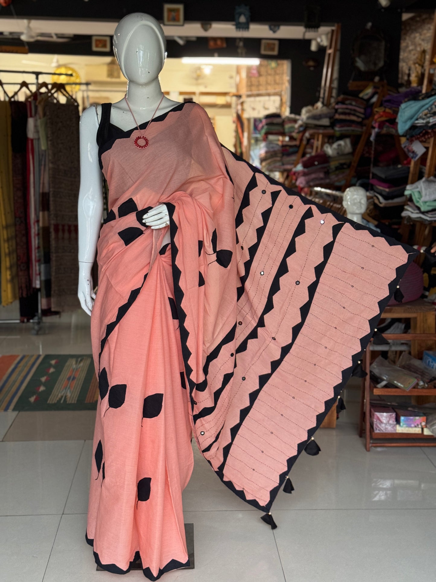 Peach soft cotton saree with black leaves Applique patches and mirror embroidery