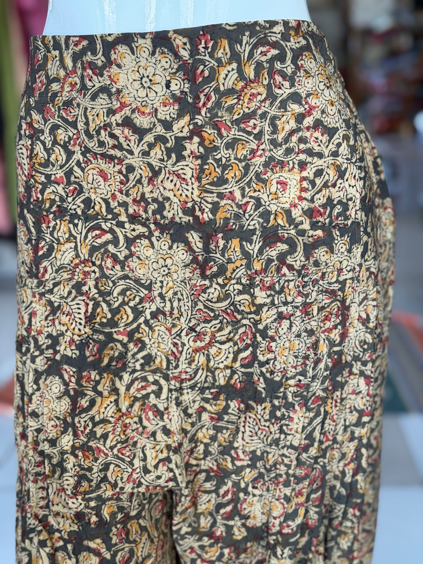 Olive green Kalamkari hand block printed cotton harem pants for women with elastic hem