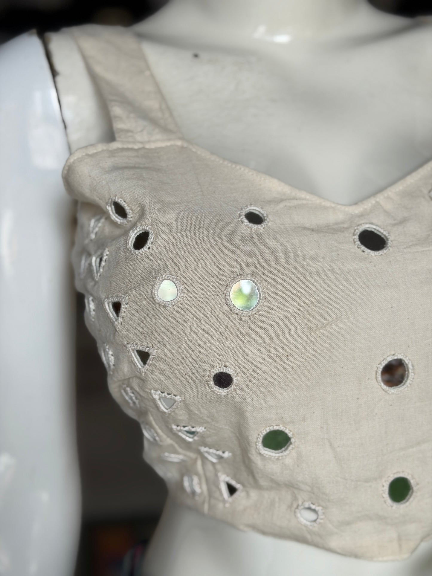 Off white kala cotton sleeveless blouse with all over colorful mirror work on front and back - adjustable back width
