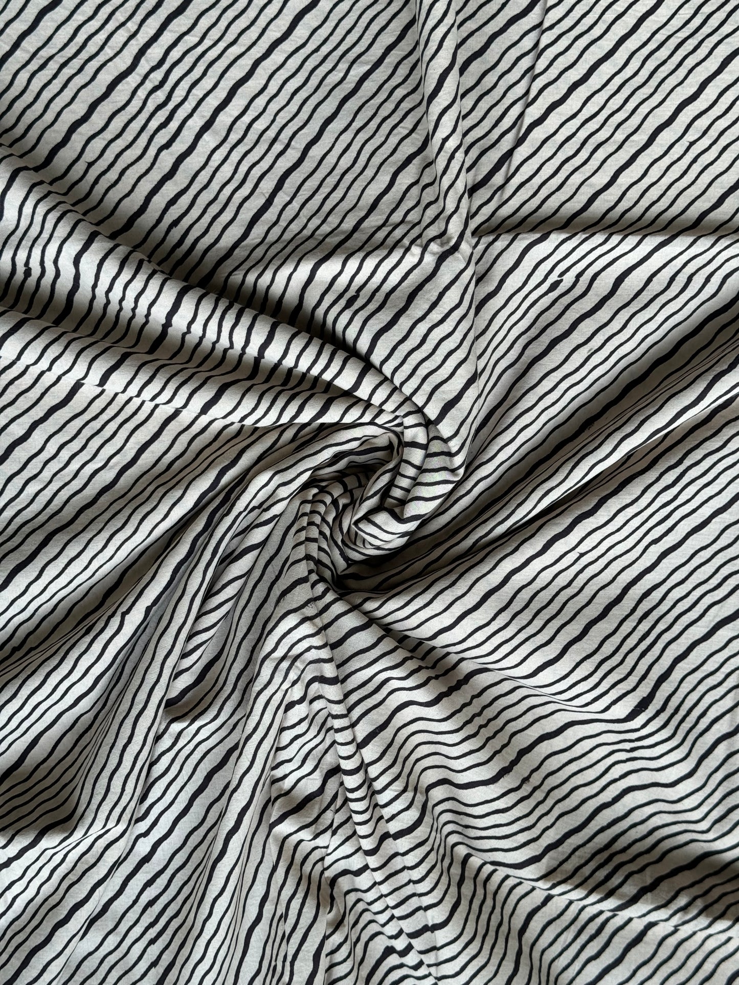 Black wavy diagonal stripes hand block printed kora cotton fabric