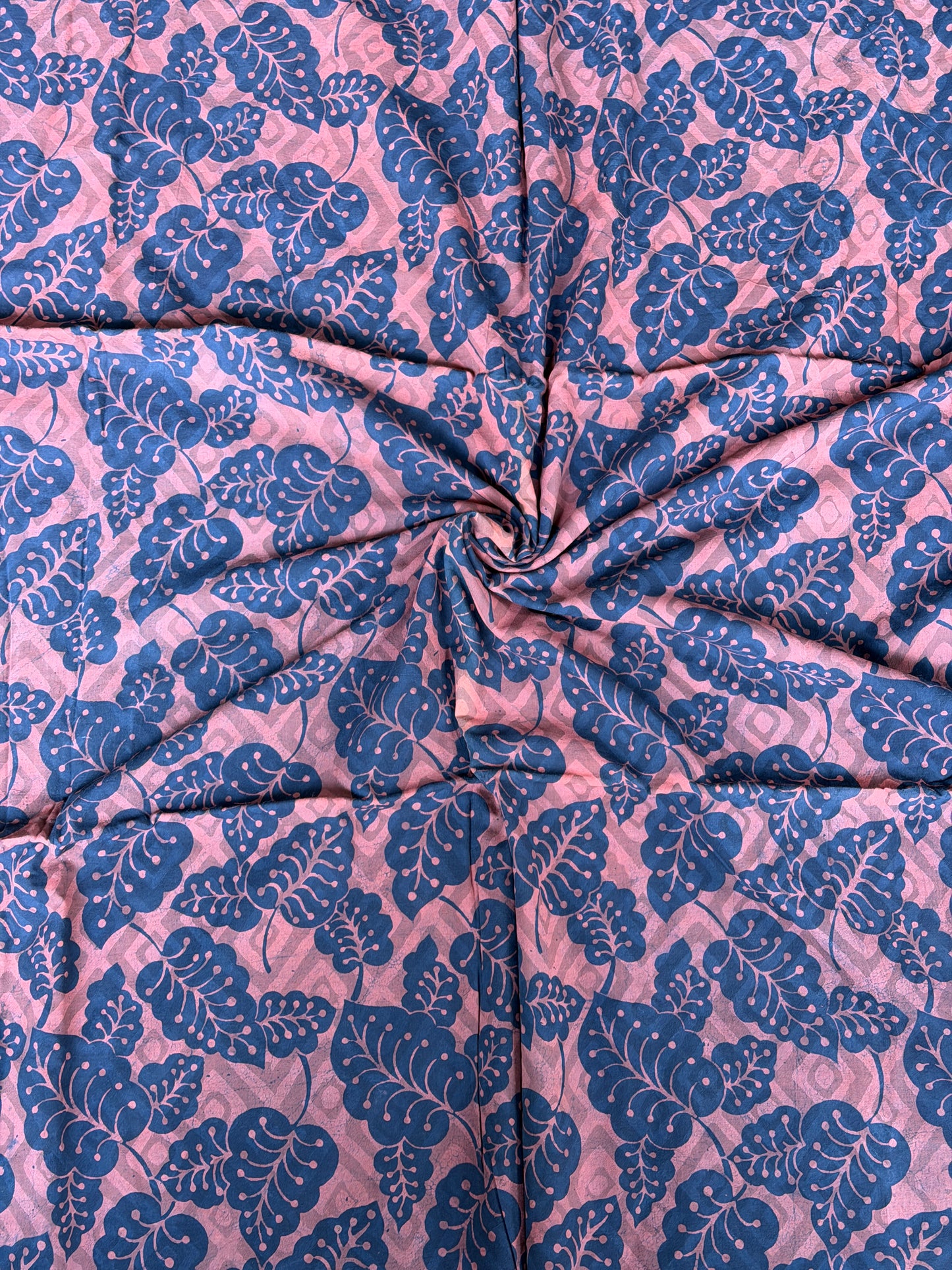 Blue leaves on light brown base hand block printed cotton fabric - double dabu print