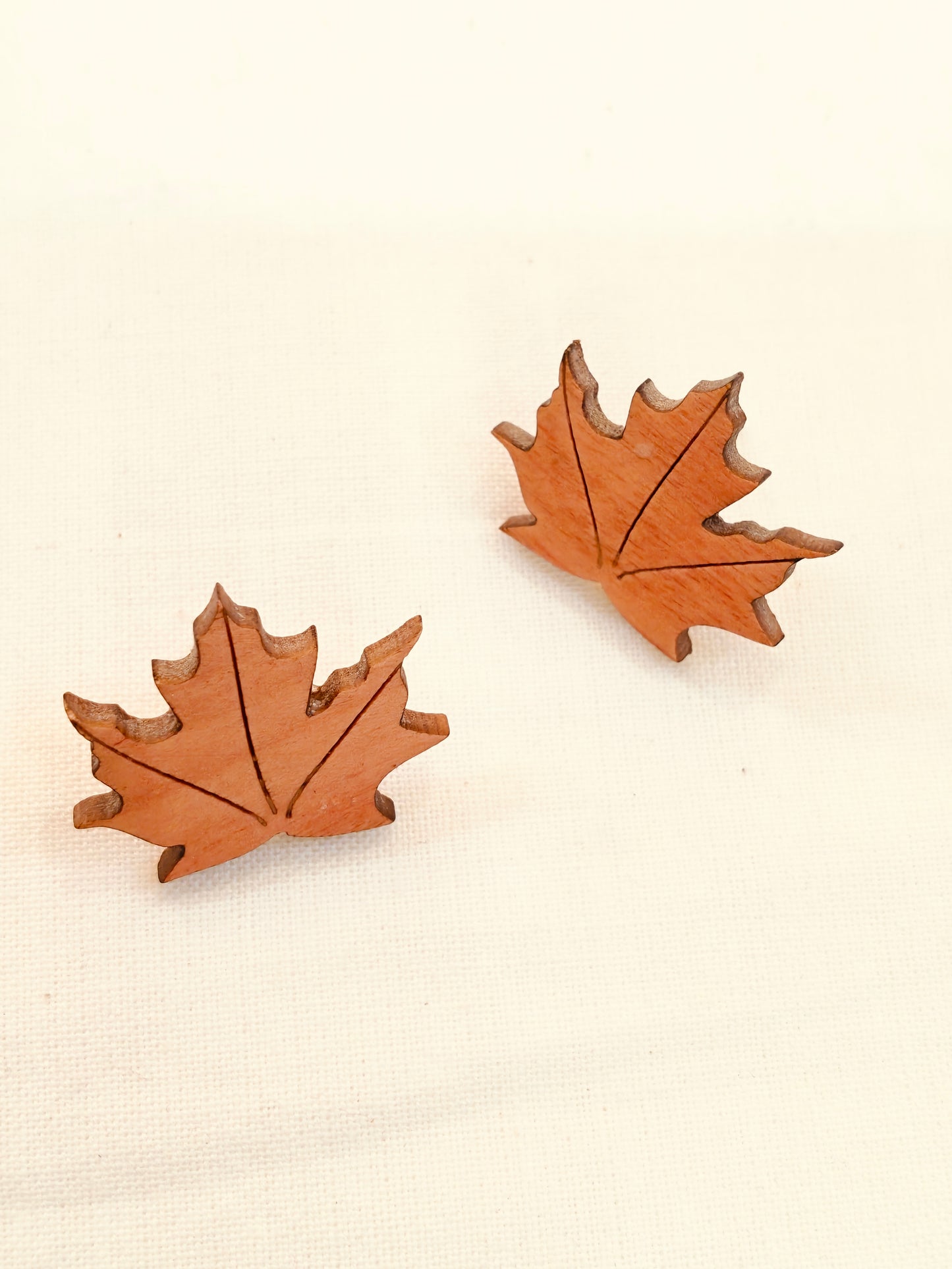 Maple leaf design earrings in wood