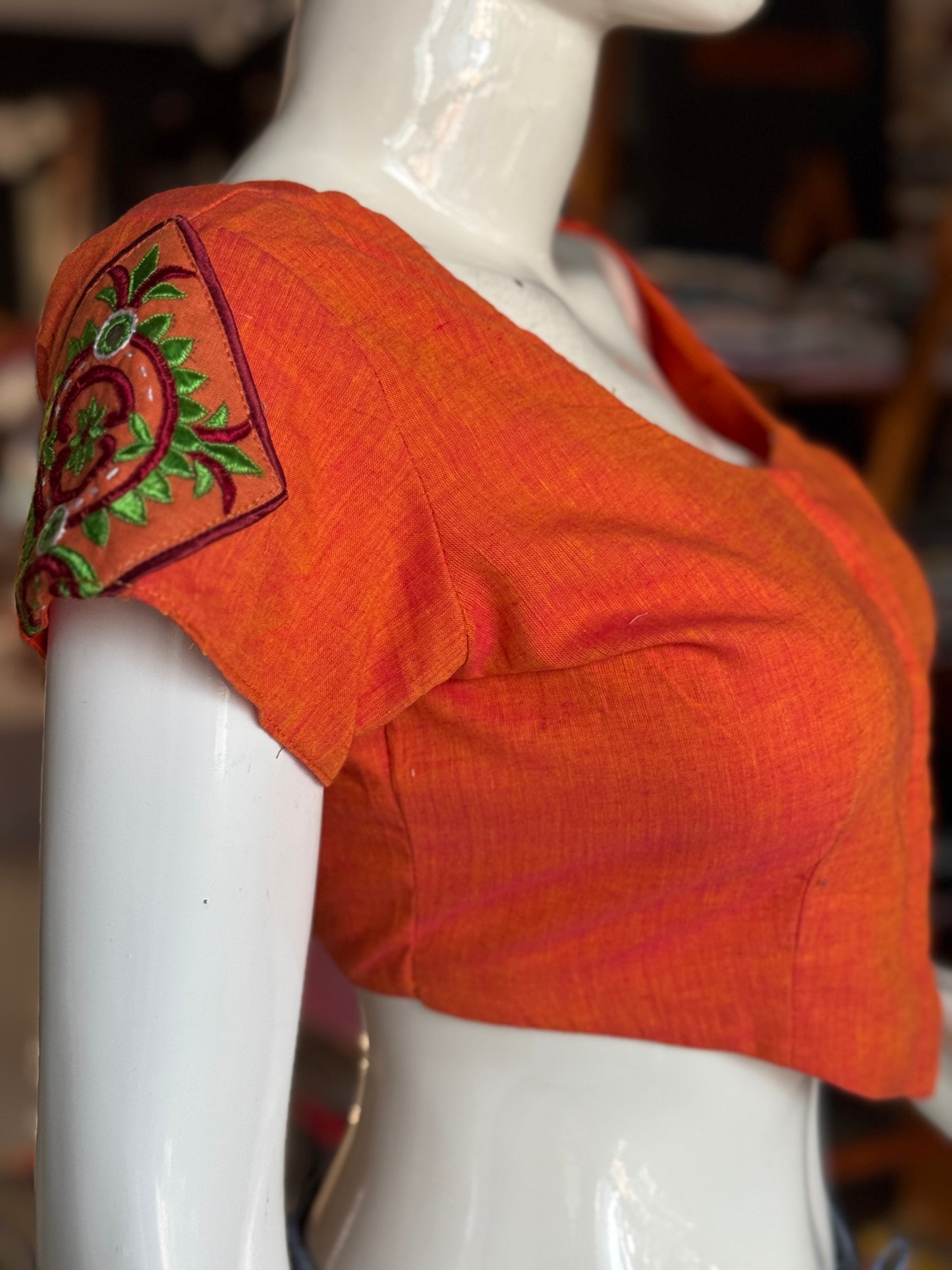 Orange cotton blouse with  embroidered patches on the back and sleeves
