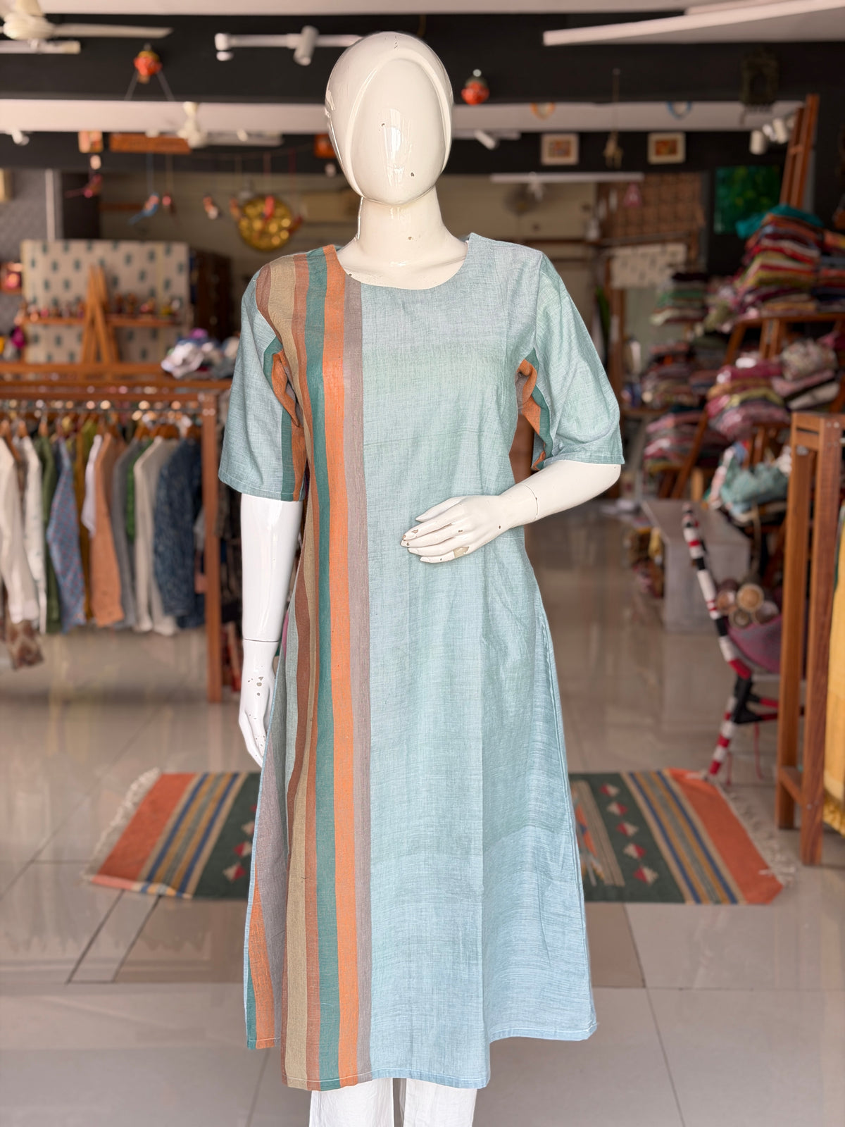 Green handloom cotton dress with hand woven kala cotton stripes on one side