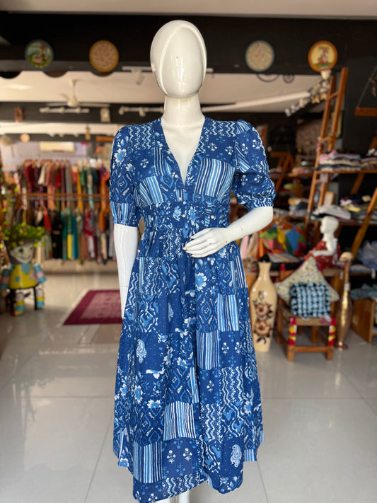 Blue patch work look hand block printed cotton dress with pintucks detailing at waist and puff sleeves with elastic hem