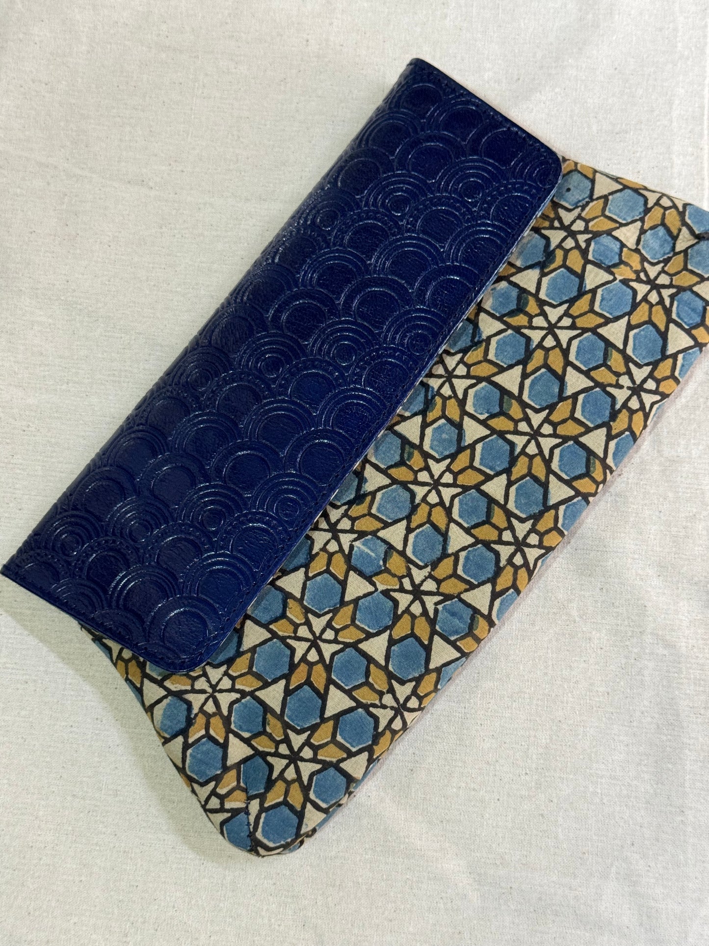 Leather hand embossed flap purse / clutch with hand block printed fabric base