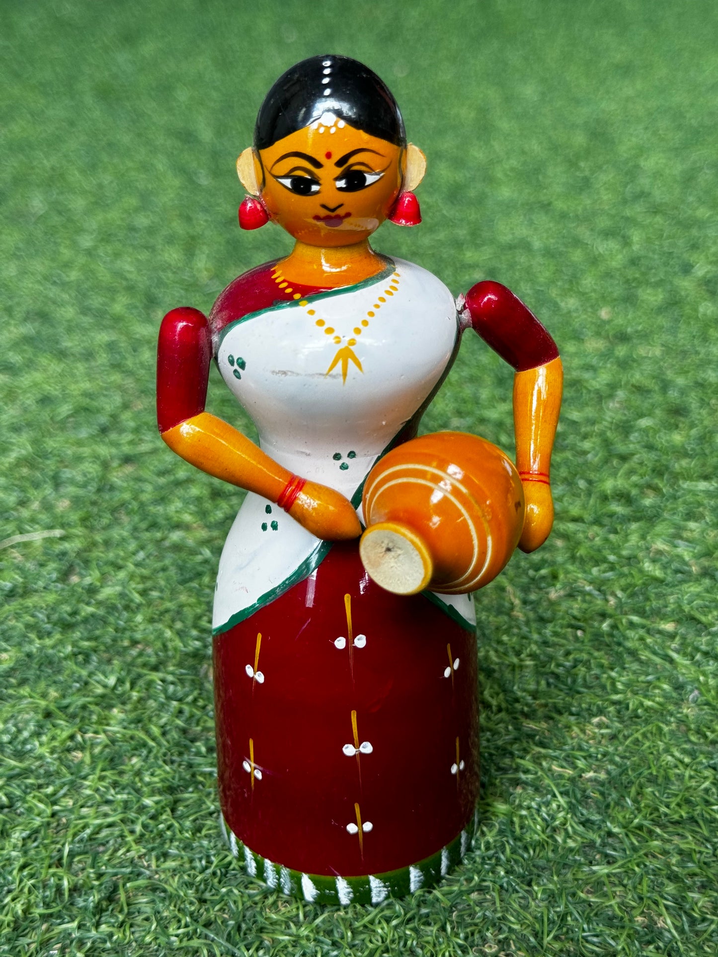 Lady in a half saree carrying pot - Etikoppaka Wooden handicraft decor